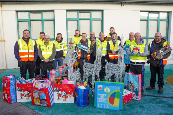 Litter management unit staff with toys they donated to Univesity Hospital Galway