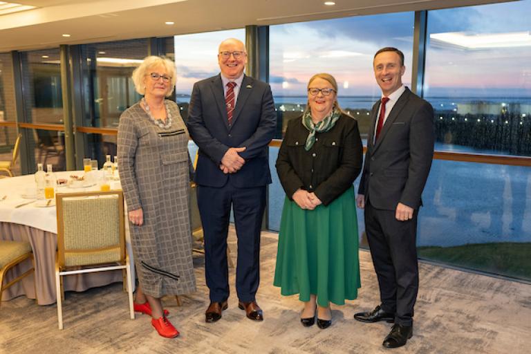 Four Representatives of Galway Chamber, Galway County Council and Galway City Council standing in a hotel room