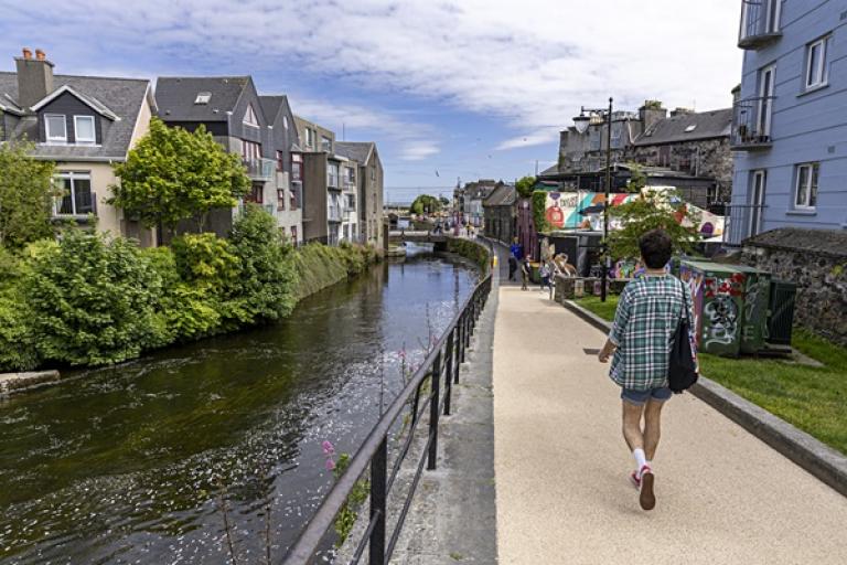 A walker using the Eglinton Canal Active Travel Scheme