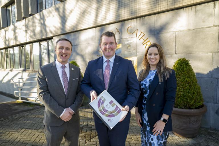 Chief Executive, Mayor of the City of Galway and Director of Finance standing with Budget Book