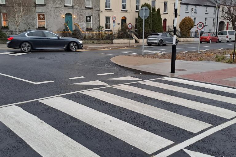 A view of the newly installed pedestrian crossing on Fr. Griffin Avenue and rain gardens at The Crescent / Sea Road junction