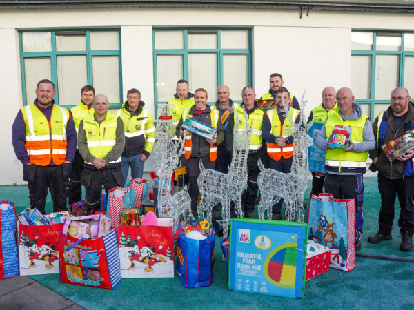 Litter management unit staff with toys they donated to Univesity Hospital Galway