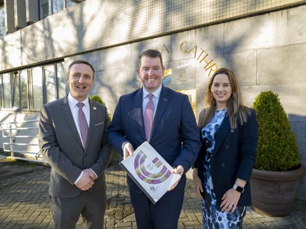 Chief Executive, Mayor of the City of Galway and Director of Finance standing with Budget Book